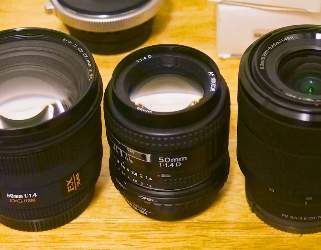 Three 50mm lenses with different front element sizes
