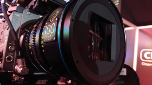 Large, black lens mounted on a professional digital cinema camera, with the anamorphic elements visible at the front.
