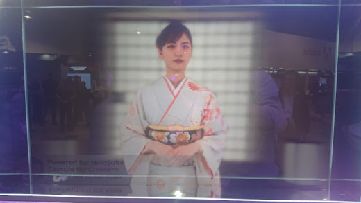 Woman in a kimono displayed on a 3D monitor