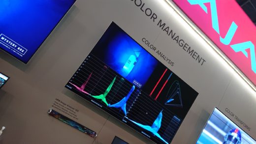 Monitor on display at an exposition, with colour analysis displays.