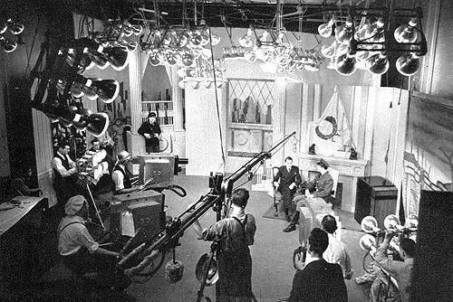 Light banks like these were common in early television studios making the working conditions unbearable at times. From "We Present Television" 1940