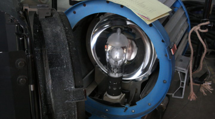 Arri Compact 6000 light, with the lens hinged open to reveal the bulb and reflector inside
