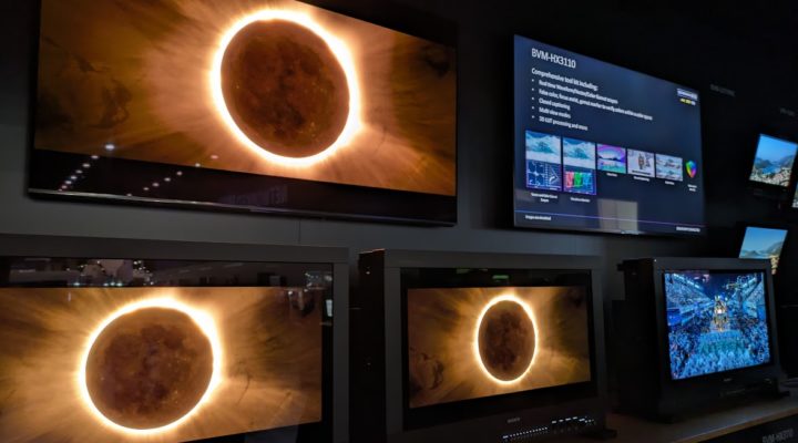 Three precision colour reference displays displaying images of a solar eclipse on the Sony booth at NAB 2024.