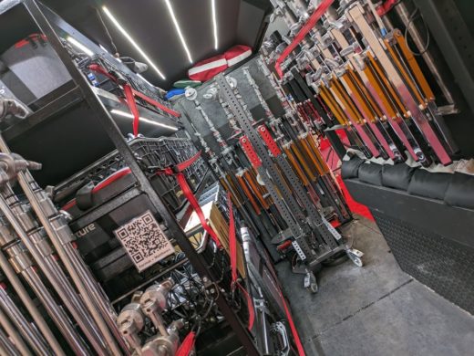 Interior of a grip van full of lighting stands.