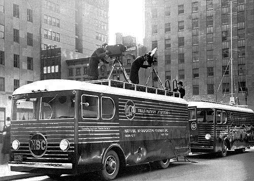 RCA Telemobiles conducting tests on New York City streets. The first is the production control room and the one parked behind it is the transmission vehicle. From "We Present Television" 1940