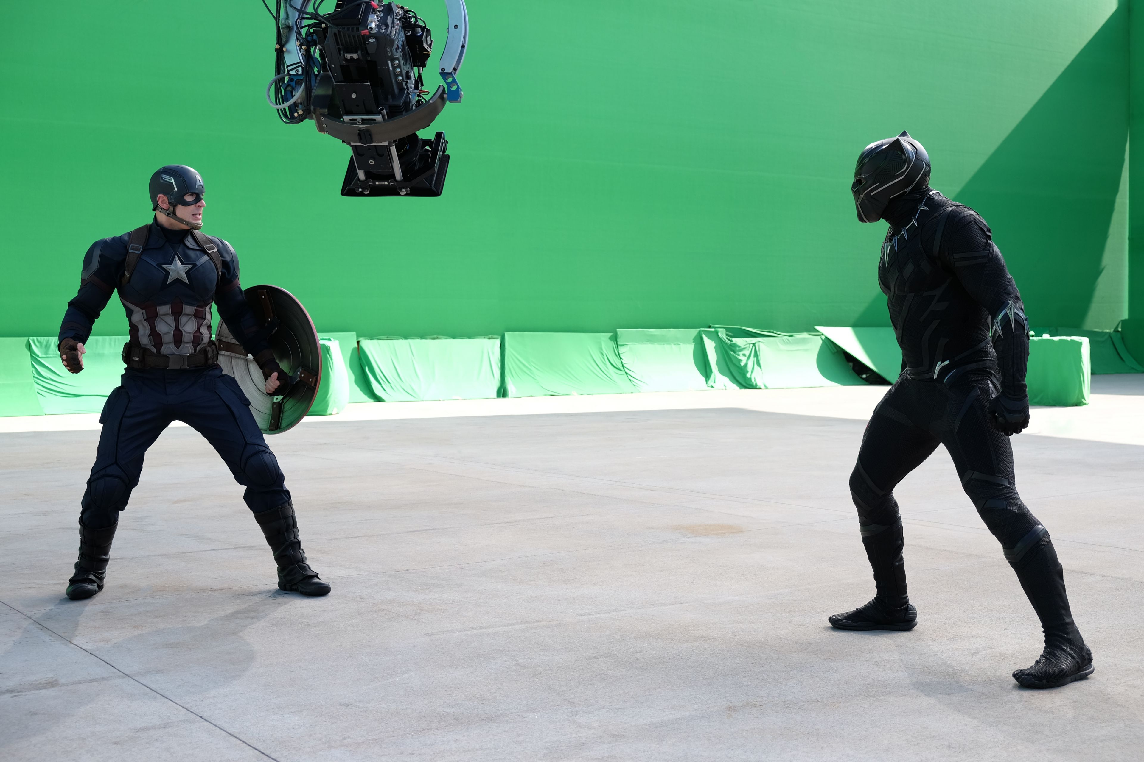 Captain America: Civil War..L to R: Chris Evans (Captain America) and Chadwick Boseman (Black Panther) on set. ..Ph: Zade Rosenthal ..©Marvel 2016