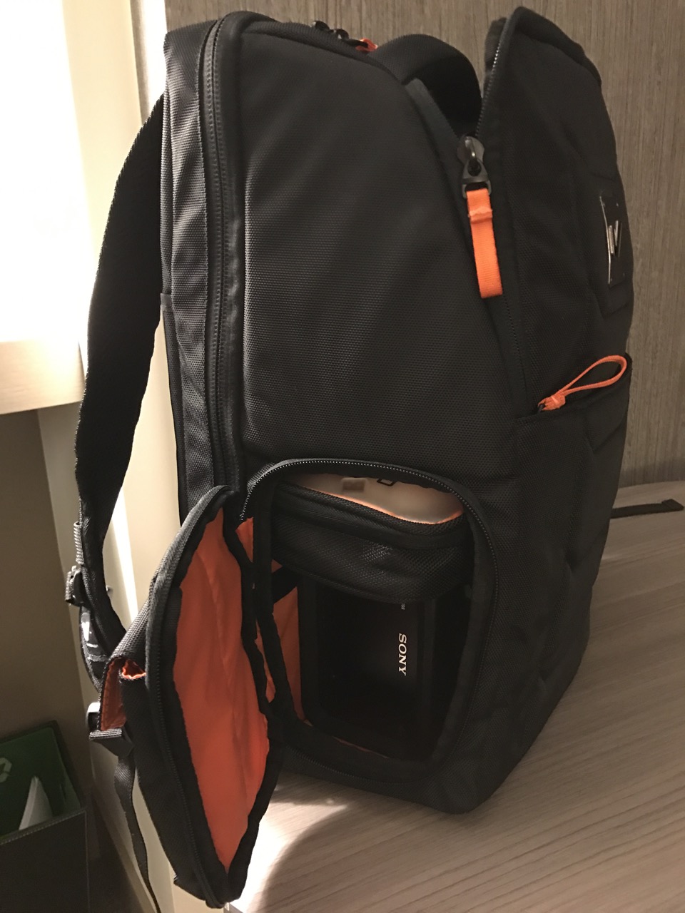 That's a Sony Rugged RAID peaking out of the bottom compartment. With a Macbook Pro in the bag it's an all-in-one editing go-bag.