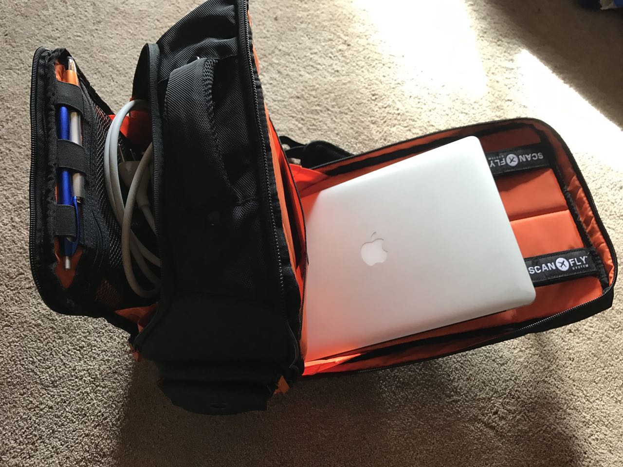 The laptop compartment unzipped all the way.