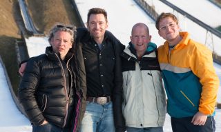 (from left): Director Dexter Fletcher, Hugh Jackman, Eddie Edwards and Taron Egerton on the set of EDDIE THE EAGLE.