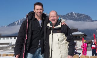 Hugh Jackman, left, poses with Eddie Edwards on the set of EDDIE THE EAGLE.