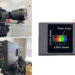 Views of the square, blocky camera from front and back, with protruding lens.