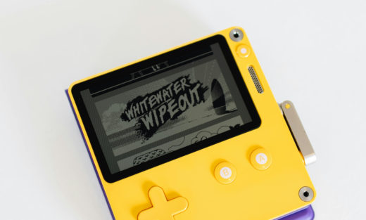 A modern reimplementation of the Nintendo Game Boy with a black on grey transreflective LCD display.