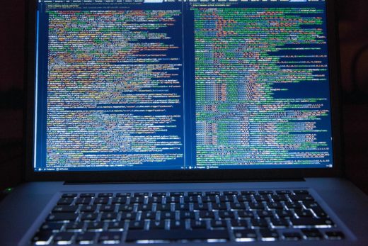 Linux on the desktop? 3 A laptop displaying closely packed lines of computer code.