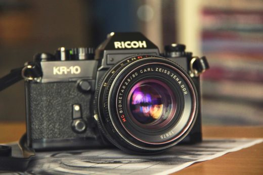 Digging for affordable lens greats 6 A Ricoh KR-10 camera with a Carl Zeiss Jena DDR MC Biometar 2.8/80mm lens attached.