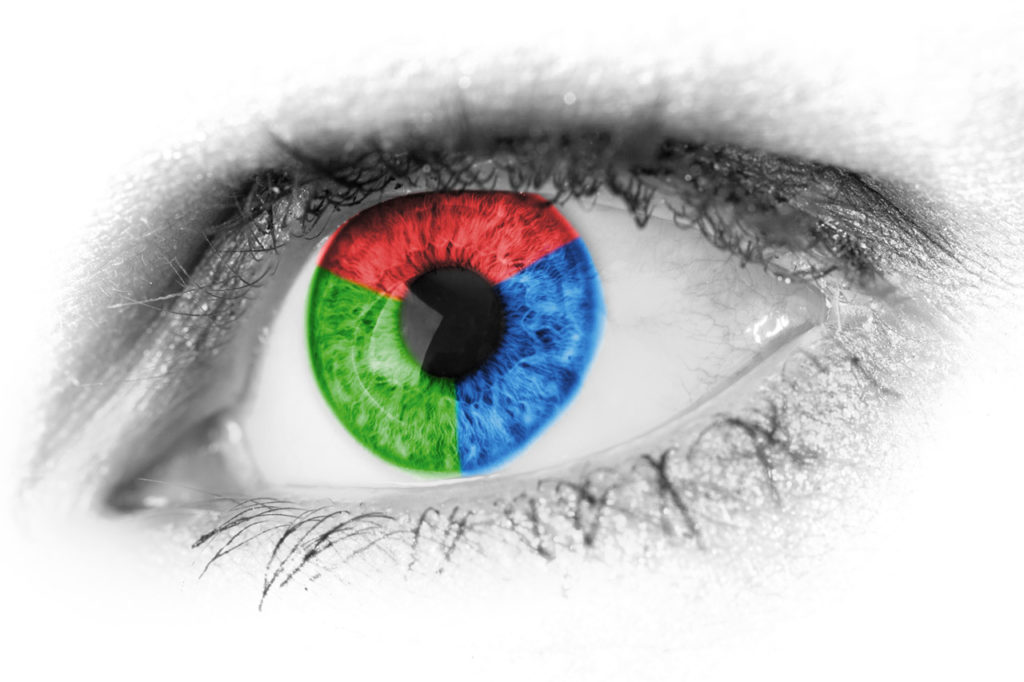 Human eye superimposed with a graphic in red, green and blue colours.