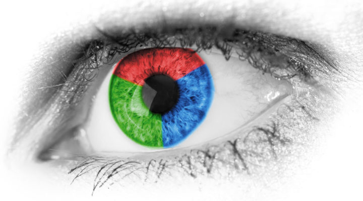 Human eye superimposed with a graphic in red, green and blue colours.